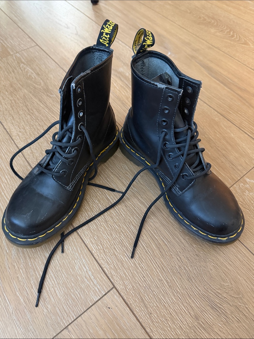 1460 smooth leatherDr. Martens Black Leather Lace-Up Boots with Yellow Stitching